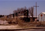 SOU 7054 leads a train westbound